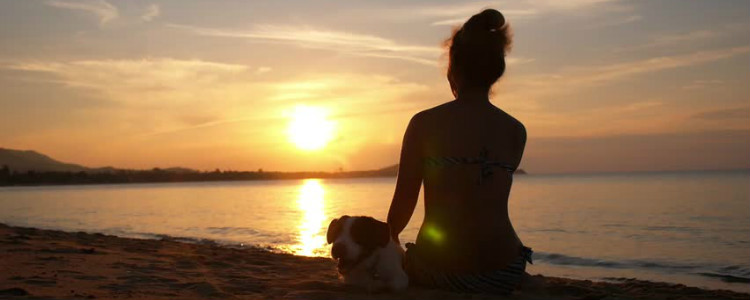 Woman Meditating on Beach