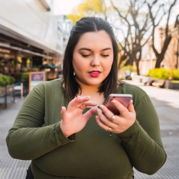 Woman taking the NEDA screening tool on her phone