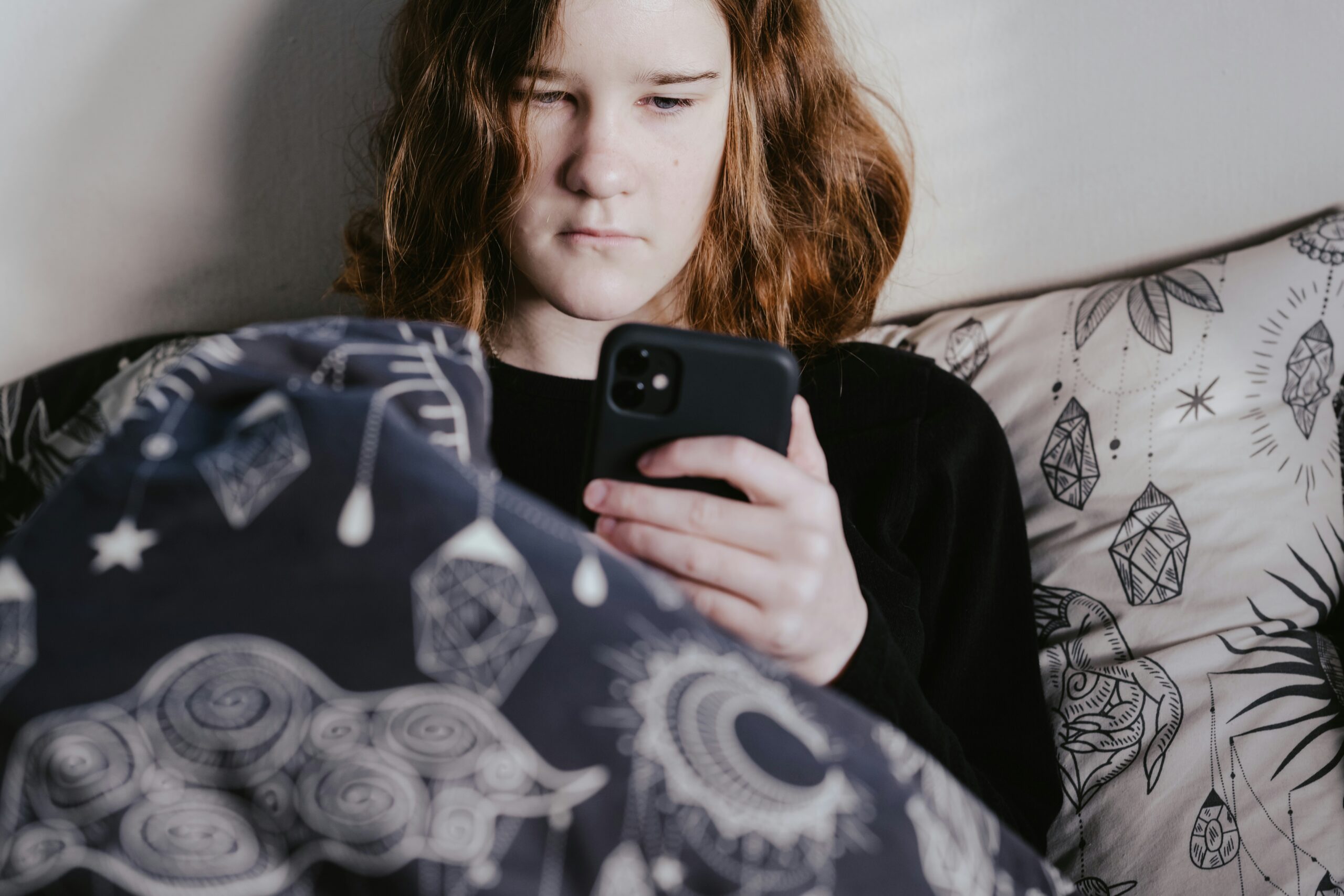 Teen looking on their phone