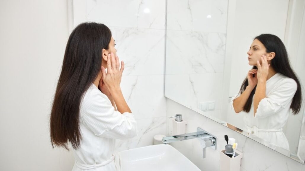 Woman looking in the mirror