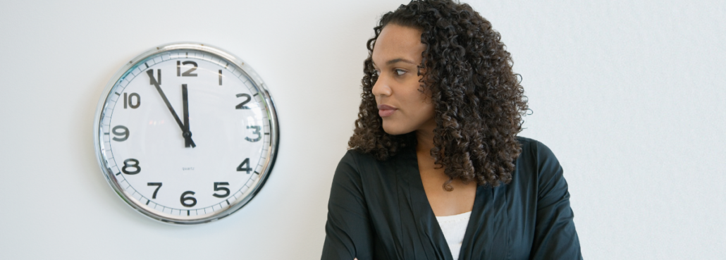 Woman with bulimia looking at clock